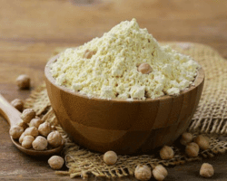 chickpea flour in a wooden bowl on the table